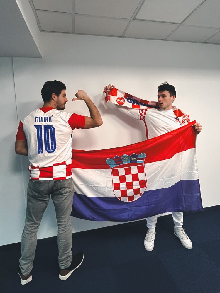 Team showing off Croatian flag for the football game